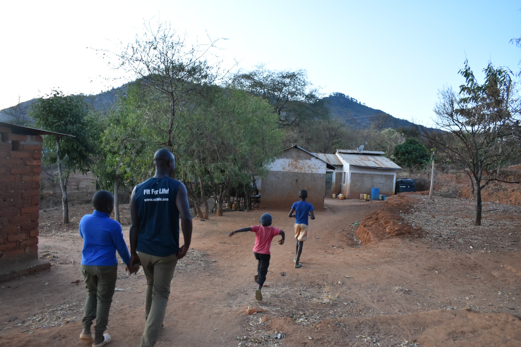 People walking through a rural community